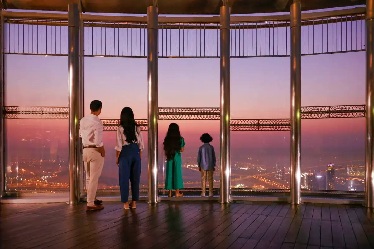 Family enjoying the Burj Khalifa observation deck at sunset