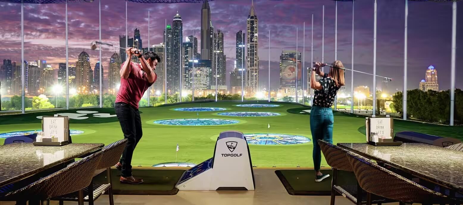Topgolf Dubai at night with skyline views